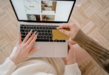 AliExpress Fined Under Digital Services Act Person shopping online using a laptop and credit card, highlighting e-commerce convenience.